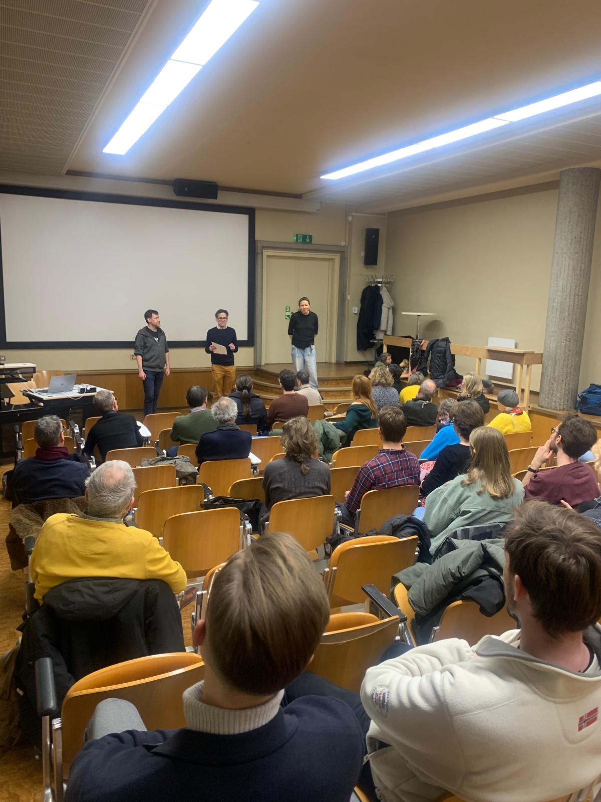Audience and speakers at the screening in Fribourg
